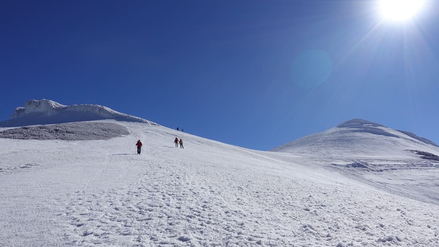 Climbers ascend Ararat under a deep blue sky - B4Experience.