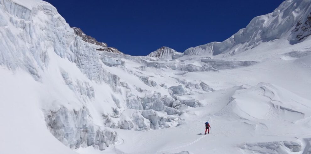 Alpinist Mountaineer walking between big walls