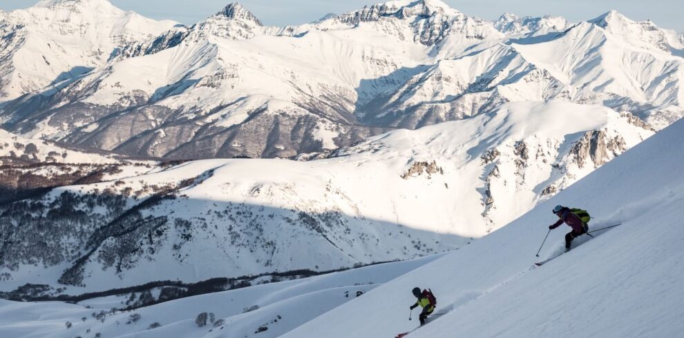 Skiers enjoying a snowy slope