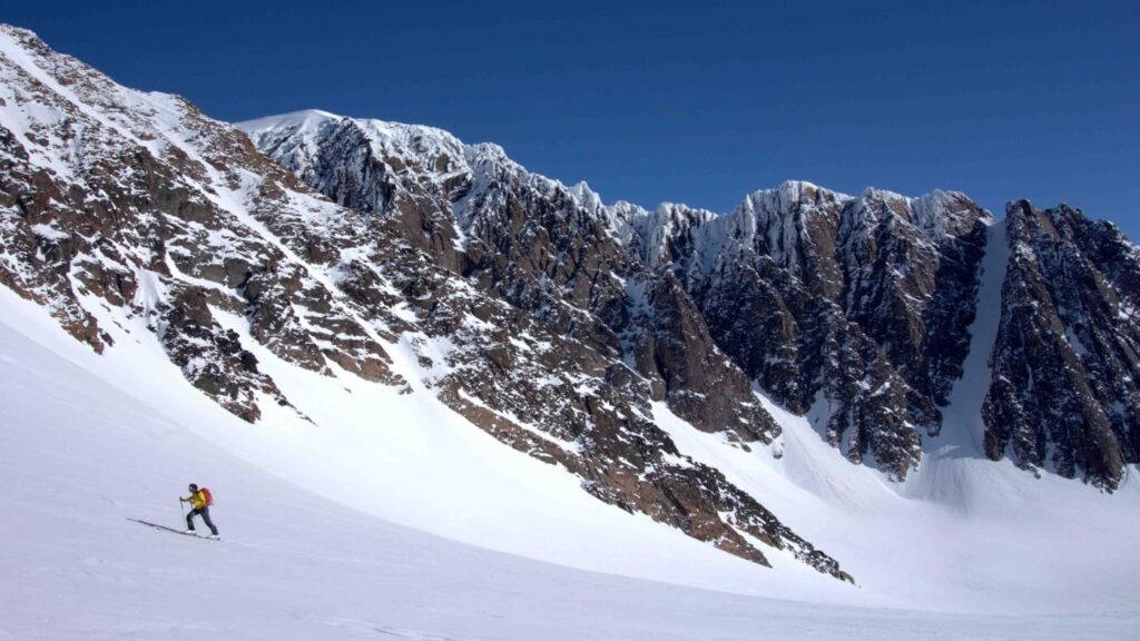 Skier going up the mountain, good snow and better descents