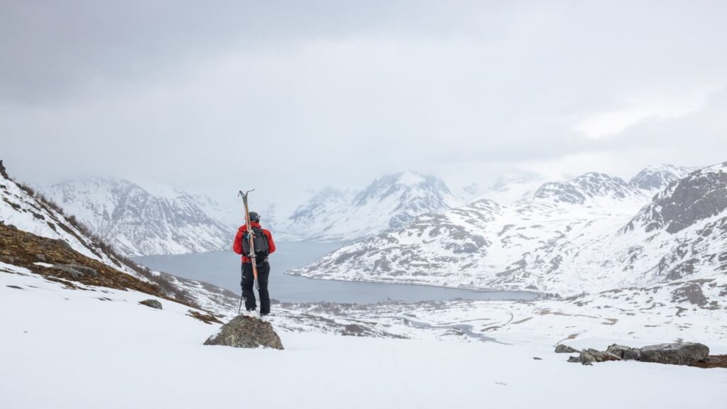 Skier takes in the magnificent views of the fjord in Tromso