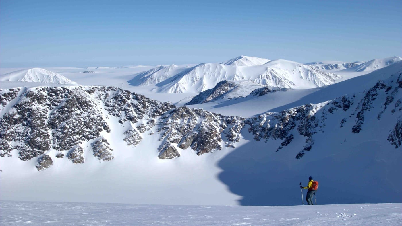 Skier in a wild Svalbard landscape