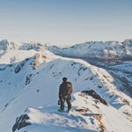 A rider looks out over the magnificent snowy landscape