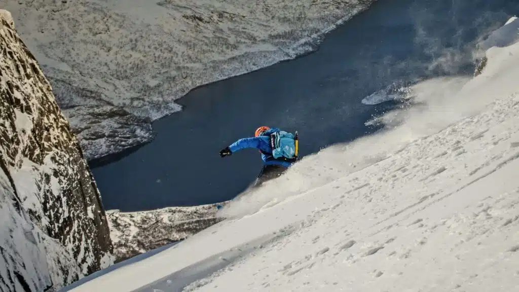 Rider descending steeply towards the sea