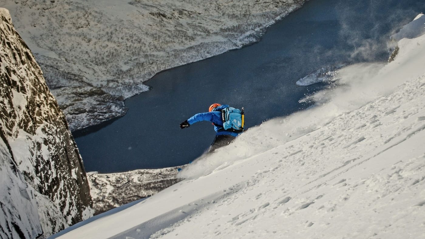 Rider descending steeply towards the sea