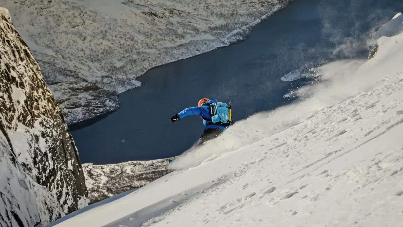 Rider descending steeply towards the sea