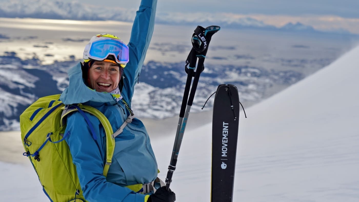 Nuria Picas says hello and smiles happily while skiing in Lofoten