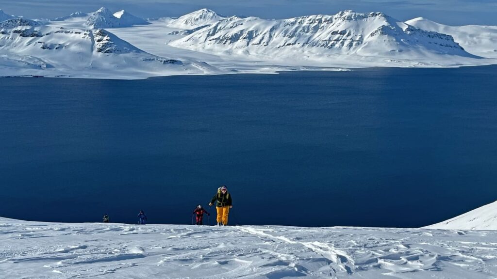 Skiers in snow landscape, Svalbard