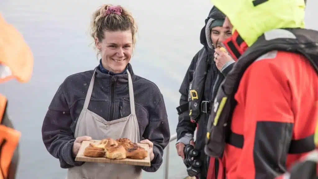 Crew enjoying pastries made by a colleague