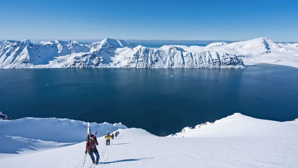 Group of cross-country skiers with the fjord in the background