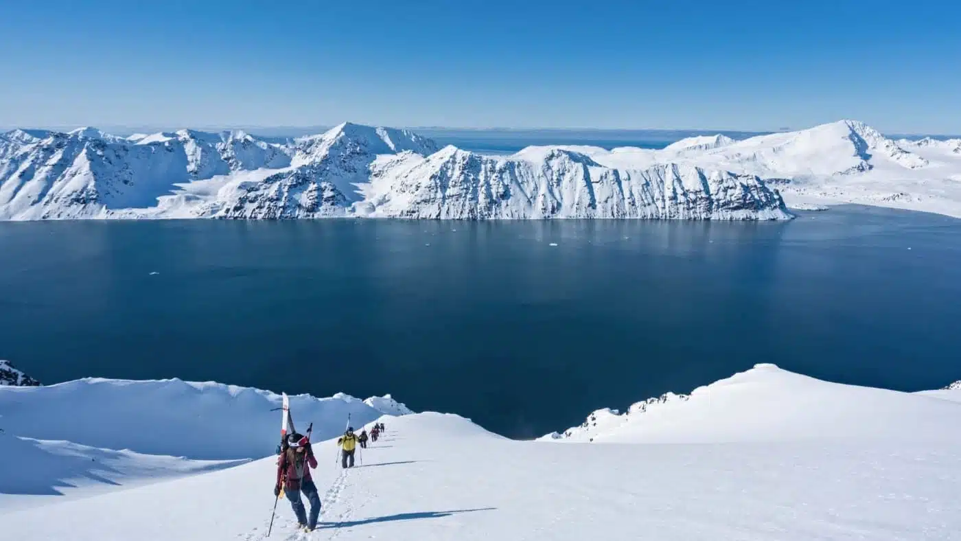 Group of cross-country skiers with the fjord in the background
