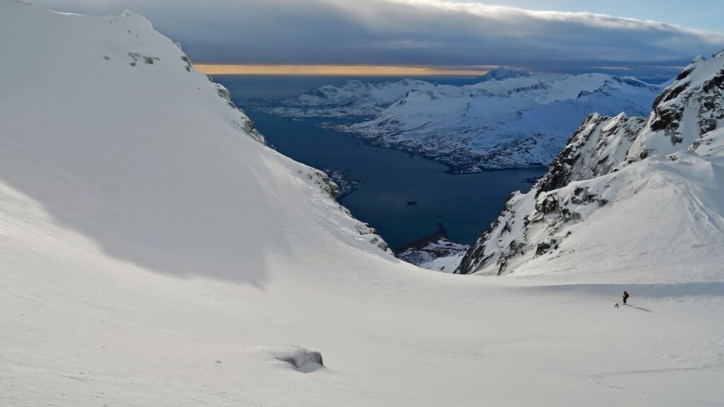 Skier enjoying the views of Lofoten fjord