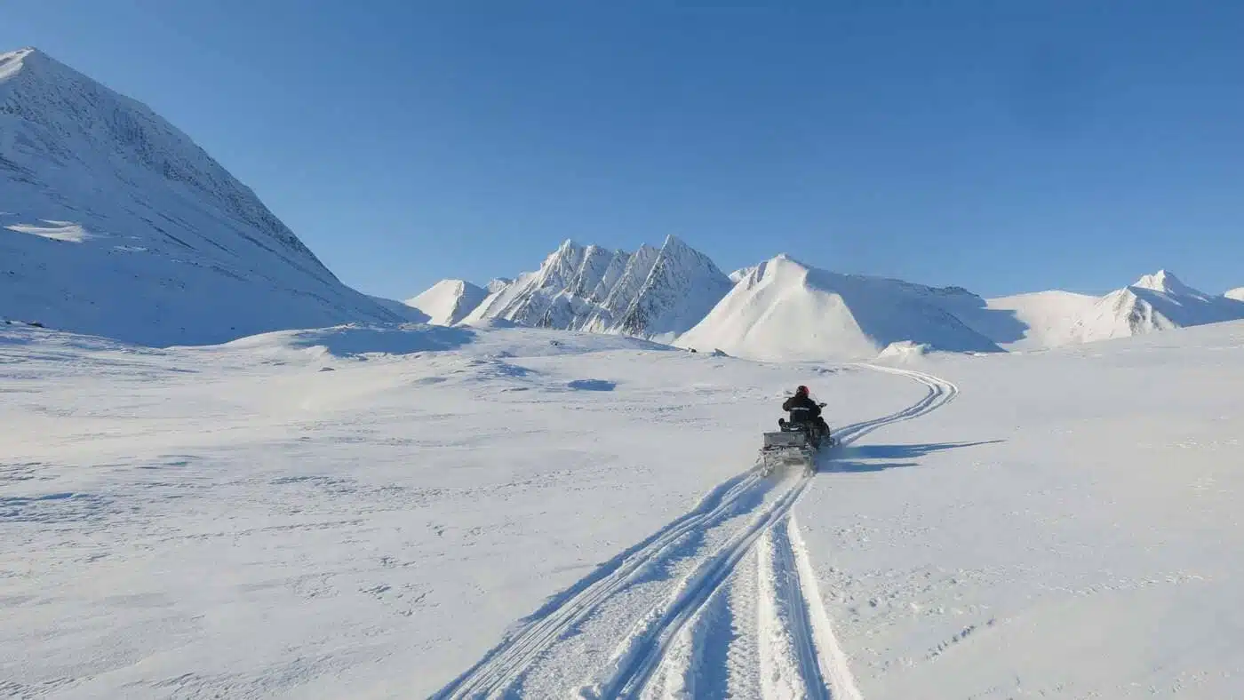 Snowmobile in the snowy landscape of Svalbard