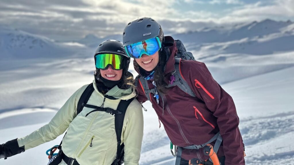 Smiling couple of skiers enjoying