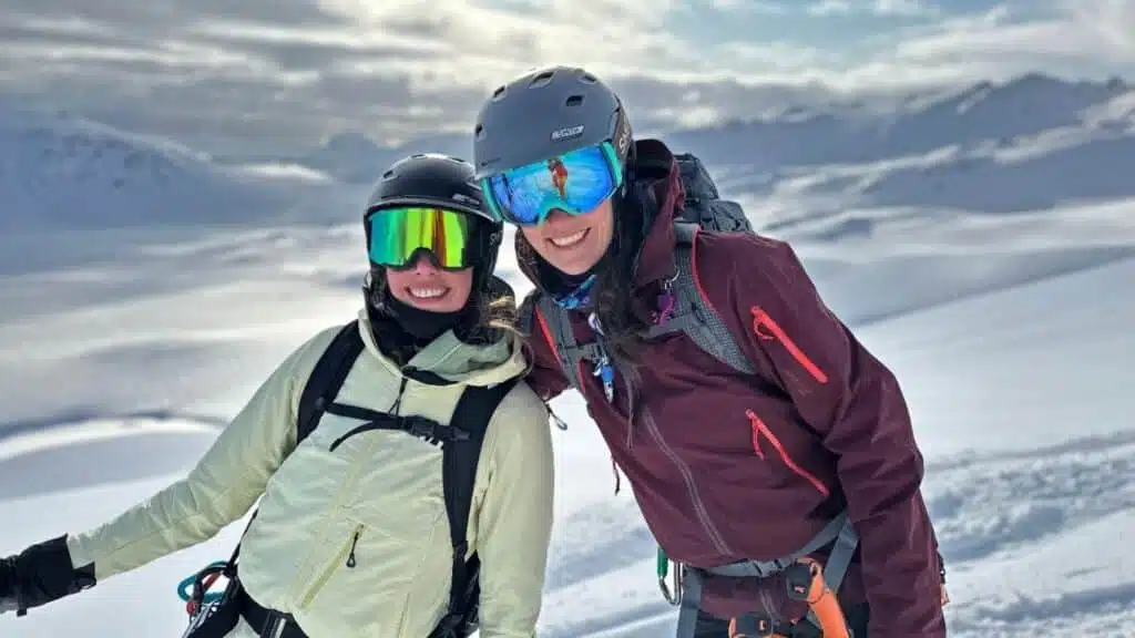 Smiling couple of skiers enjoying