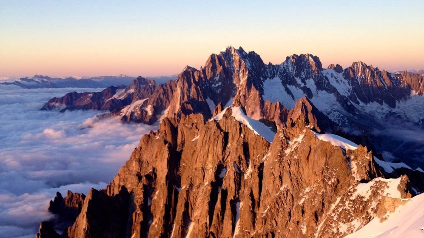 Sharp ridges rise above the clouds at Aiguille du Midi with B4Experience