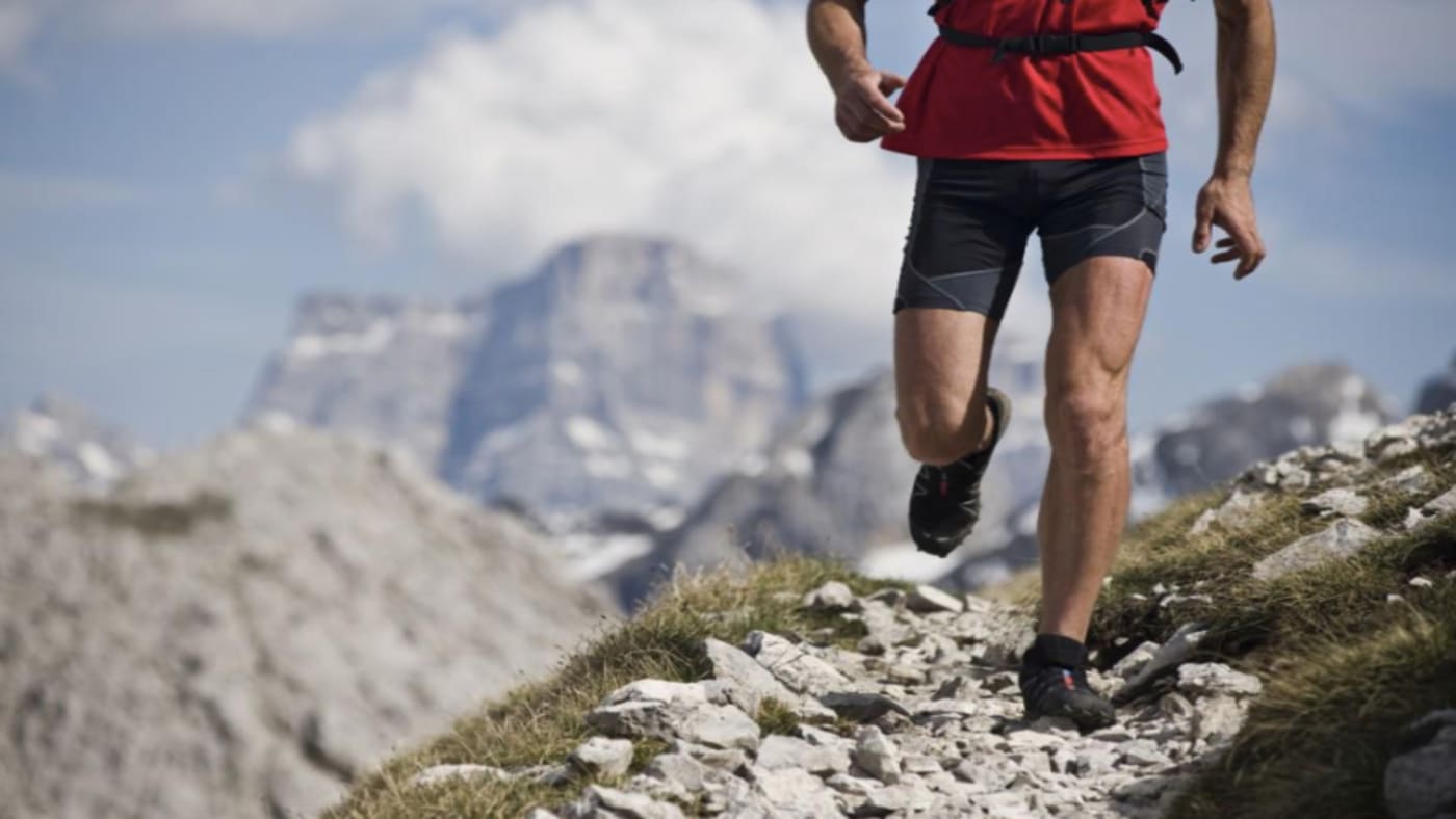 Alpirunning Mont Blanc Camp-trail runner navigating a rocky alpine path with B4Experience