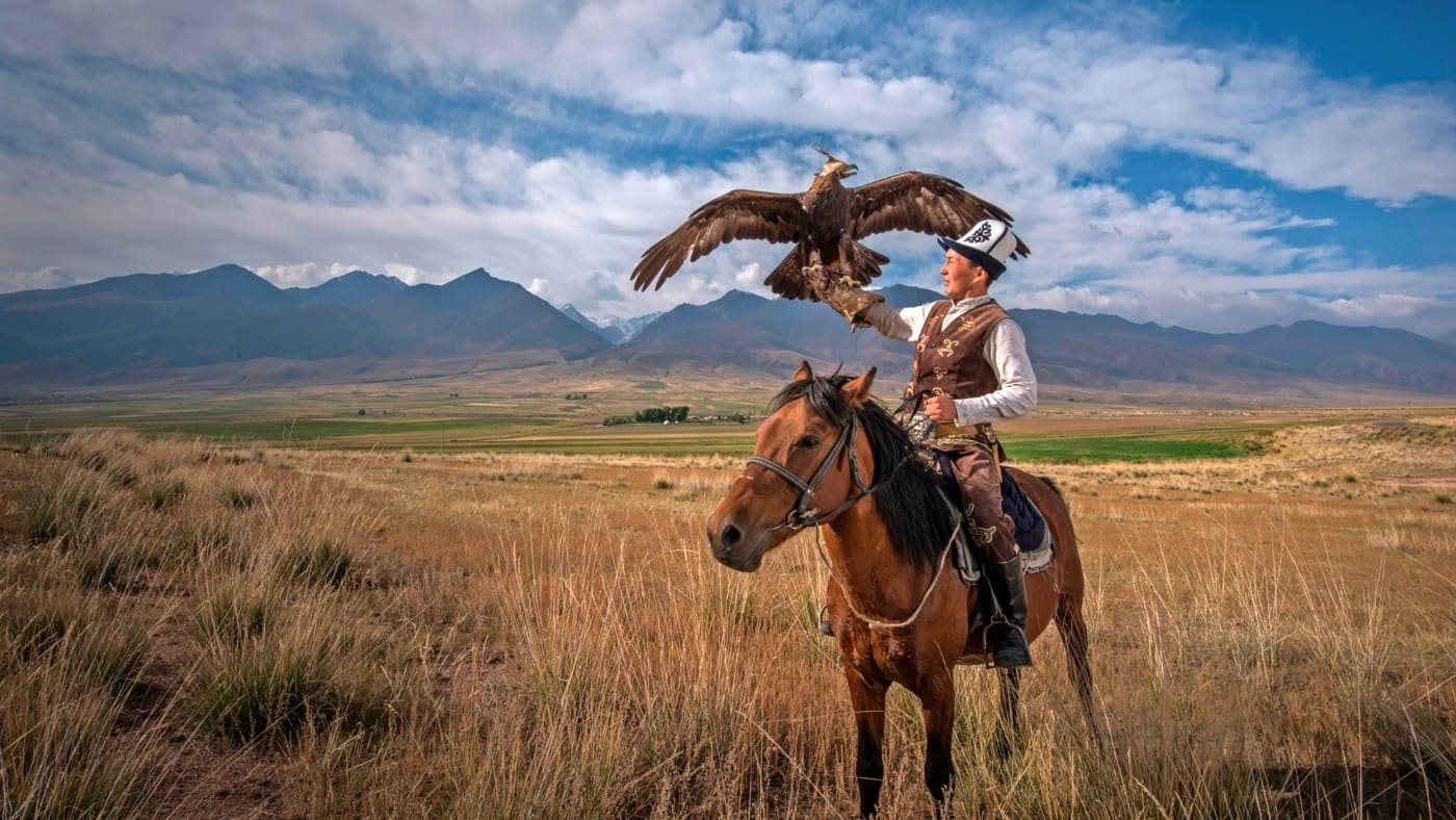 Eagle hunter on horseback in Kyrgyzstan with B4Experience