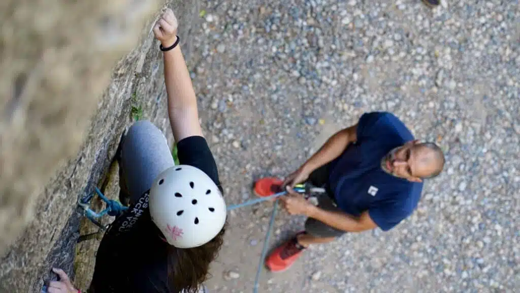 Climbing instruction with a belayer guiding the climber with B4Experience