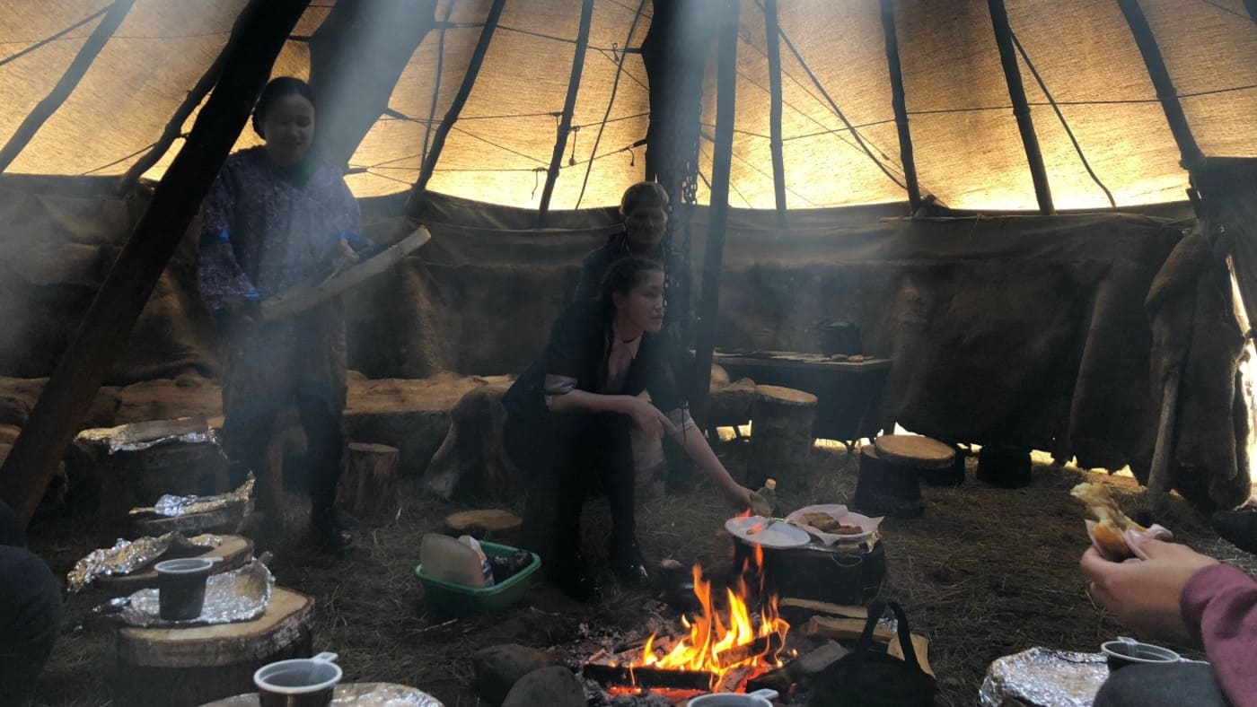 Traditional reindeer herders' tent in Kamchatka with a fire at the center with B4Experience