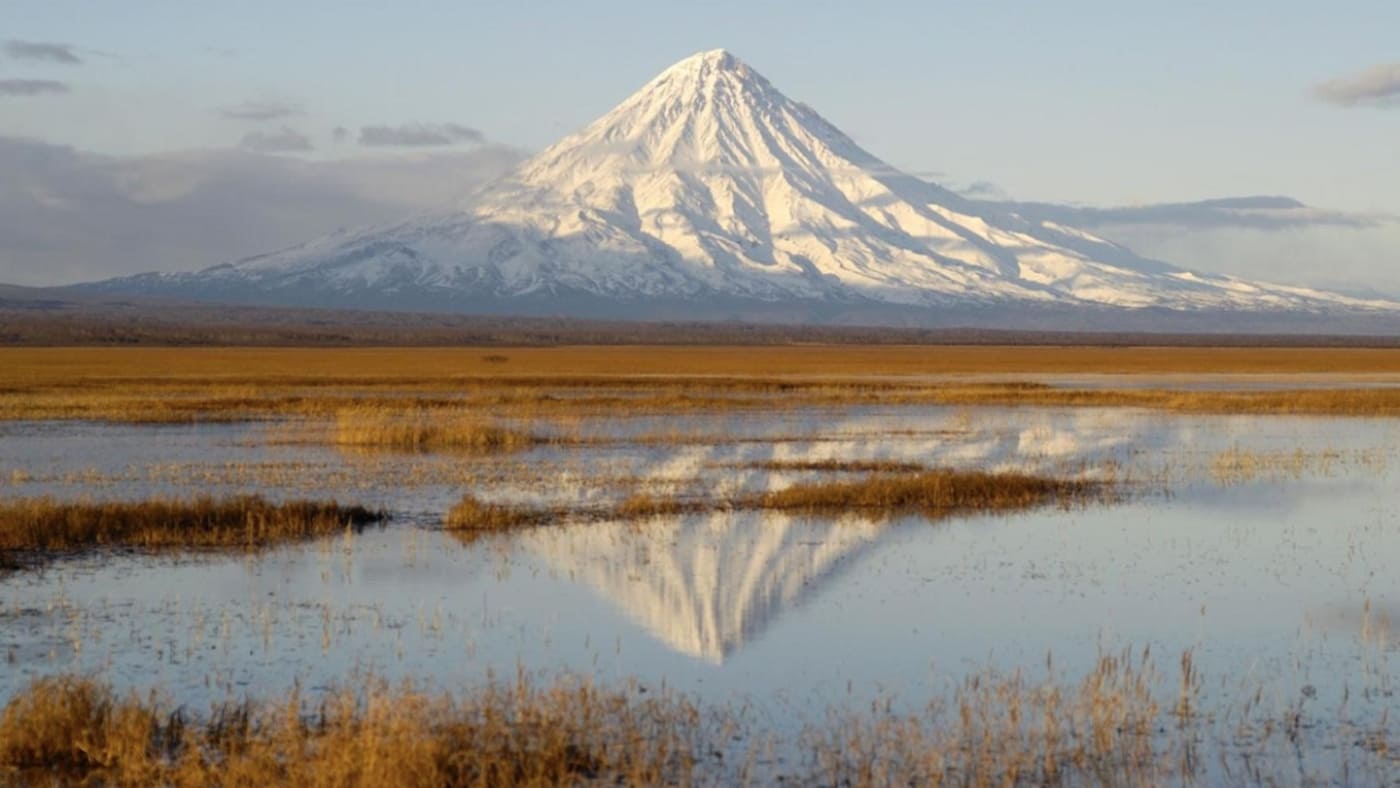 A snow-capped volcano reflected in Kamchatka's wetlands with B4Experience