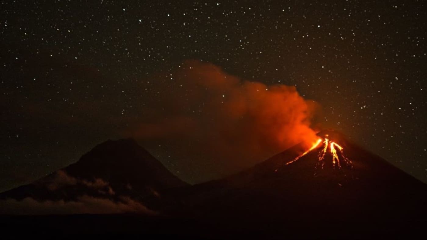 A volcanic eruption lights up the night sky in Kamchatka with B4Experience