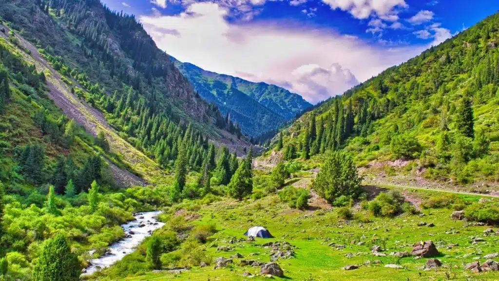 Kyrgyzstan trekking through lush green valleys and mountains with B4Experience