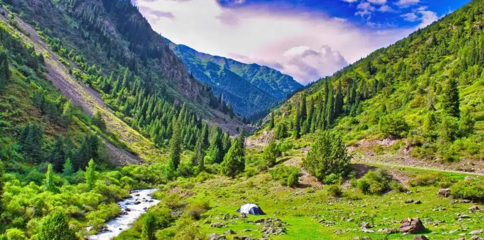 Kyrgyzstan trekking through lush green valleys and mountains with B4Experience