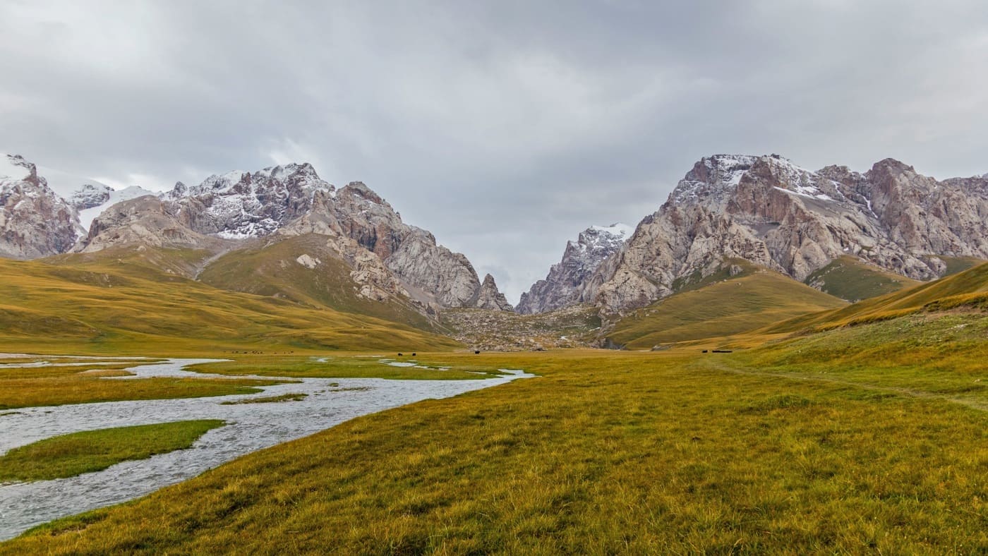 Scenic landscape of Kyrgyzstan with mountains and winding rivers with B4Experience