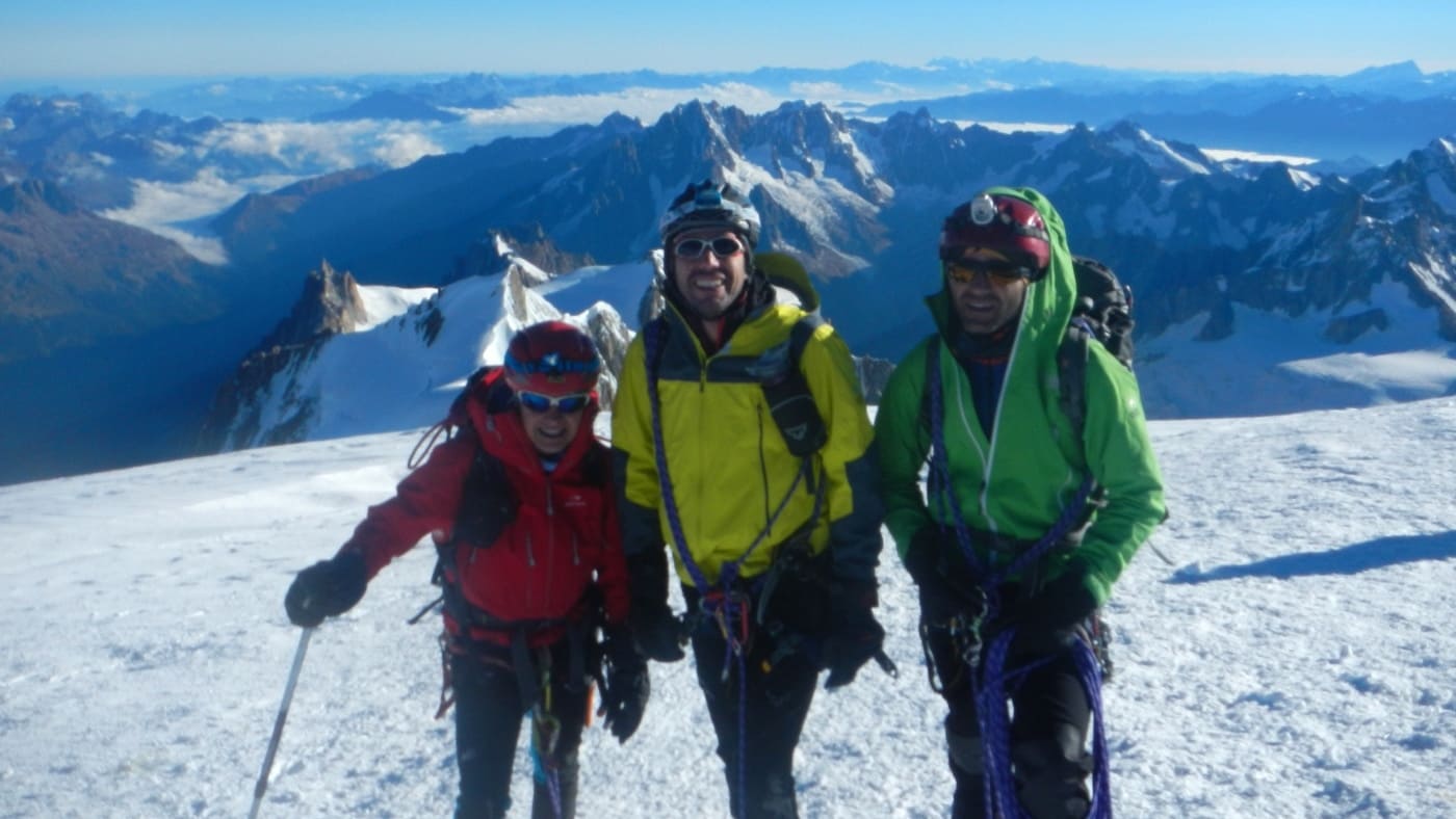 Smiling climbers stand atop Mont Blanc with B4Experience