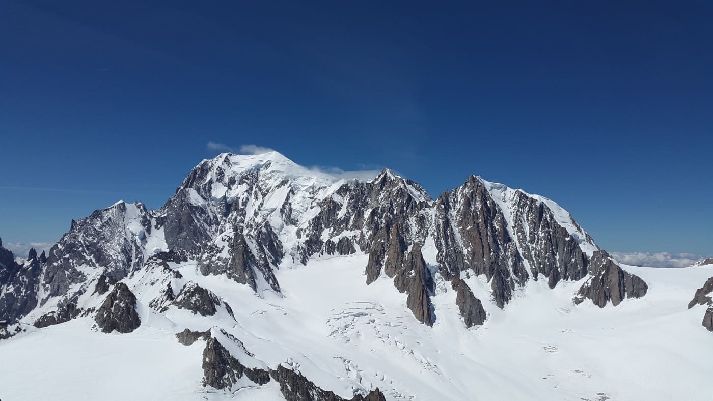 Sharp peaks and deep snowfields define this alpine giant with B4Experience