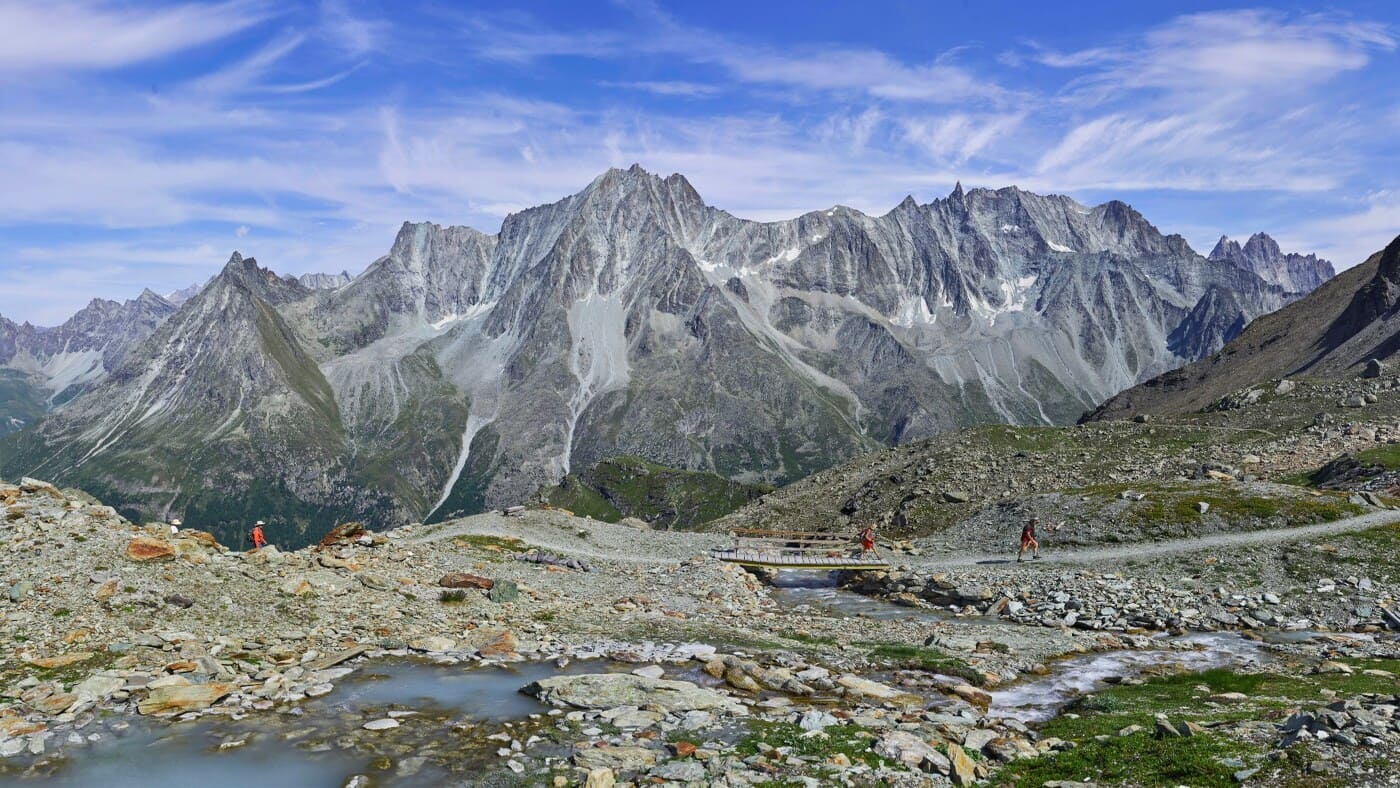 Landscape with towering peaks and rocky valley in the Alps with B4Experience