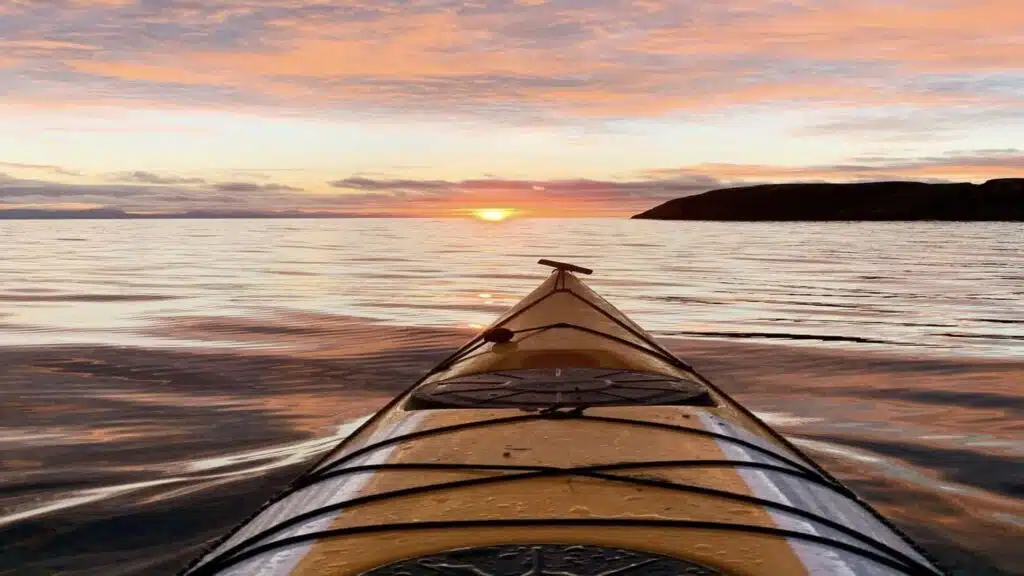 Kayaking through Lofoten's golden sunset with B4Experience.