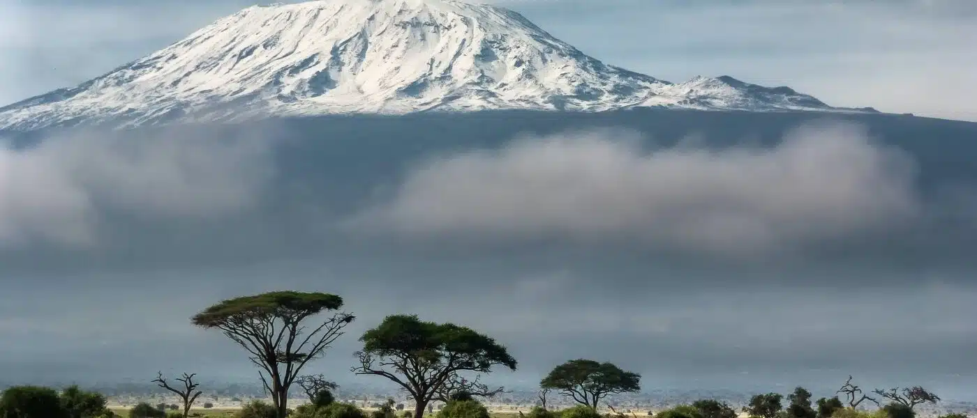 Mount Kilimanjaro towering over the African savannah with B4Experience