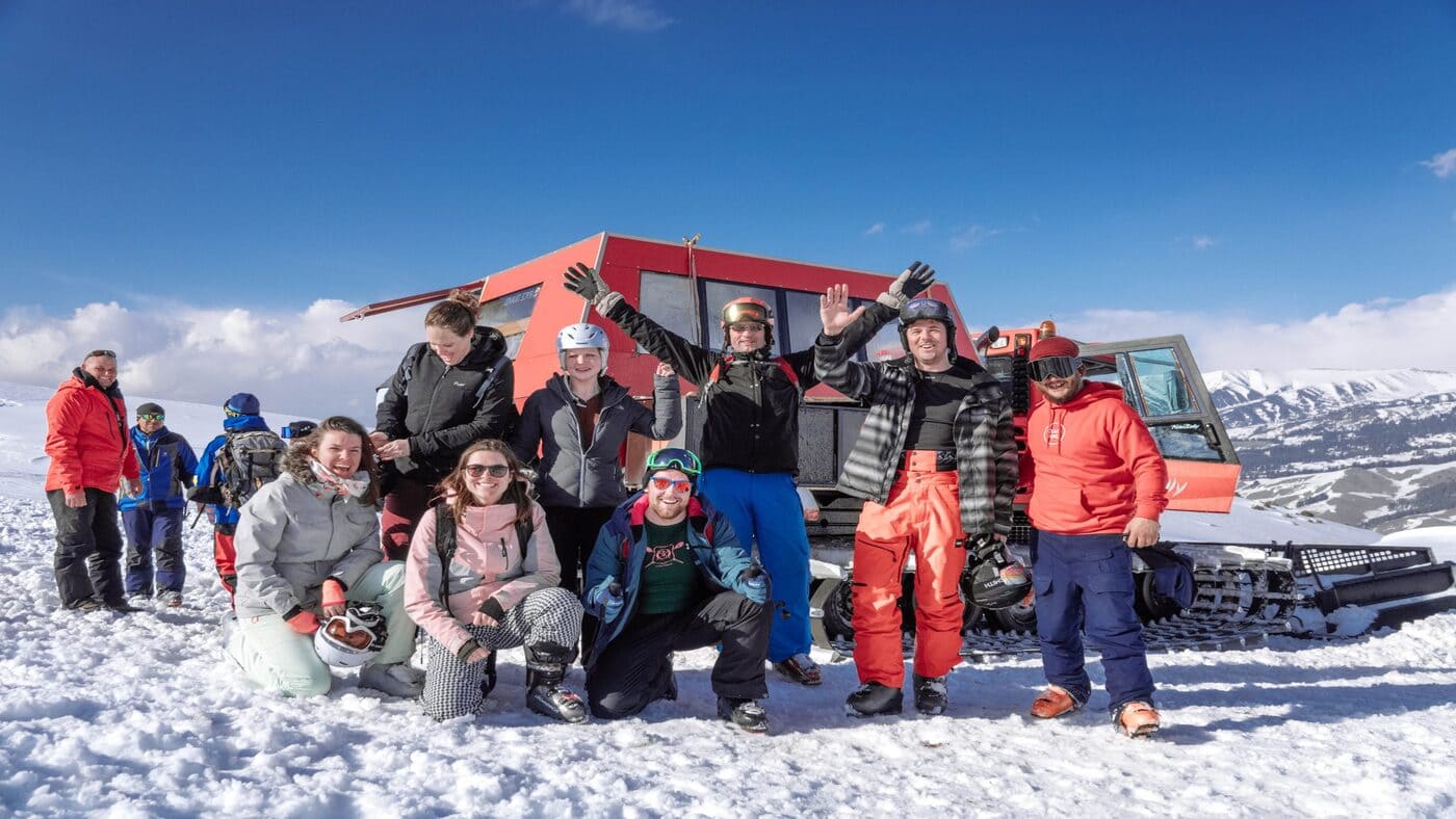 Adventure seekers enjoying the Kyrgyzstan freeride camp in deep snow - B4Experience