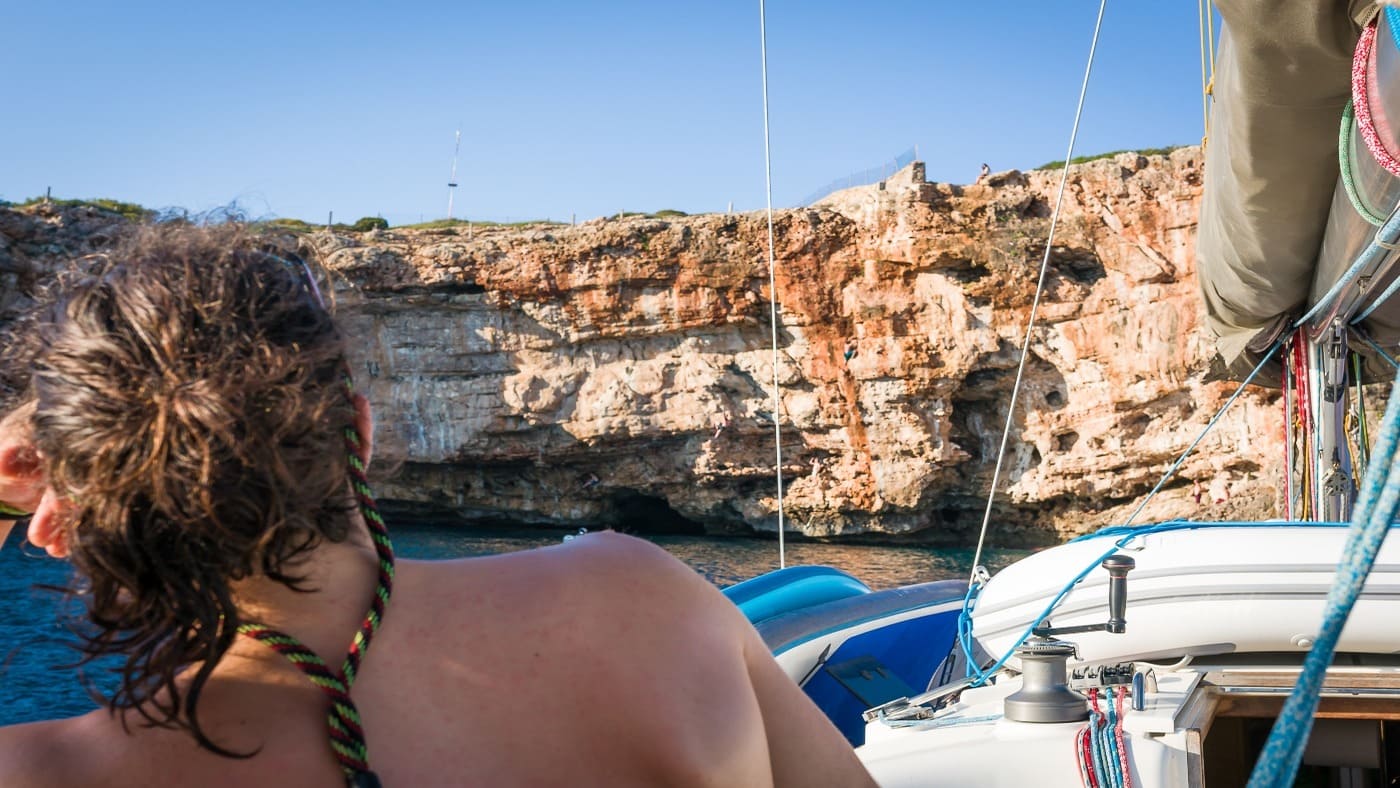 Relaxing on a sailboat, preparing for deep-water soloing in Mallorca with B4Experience