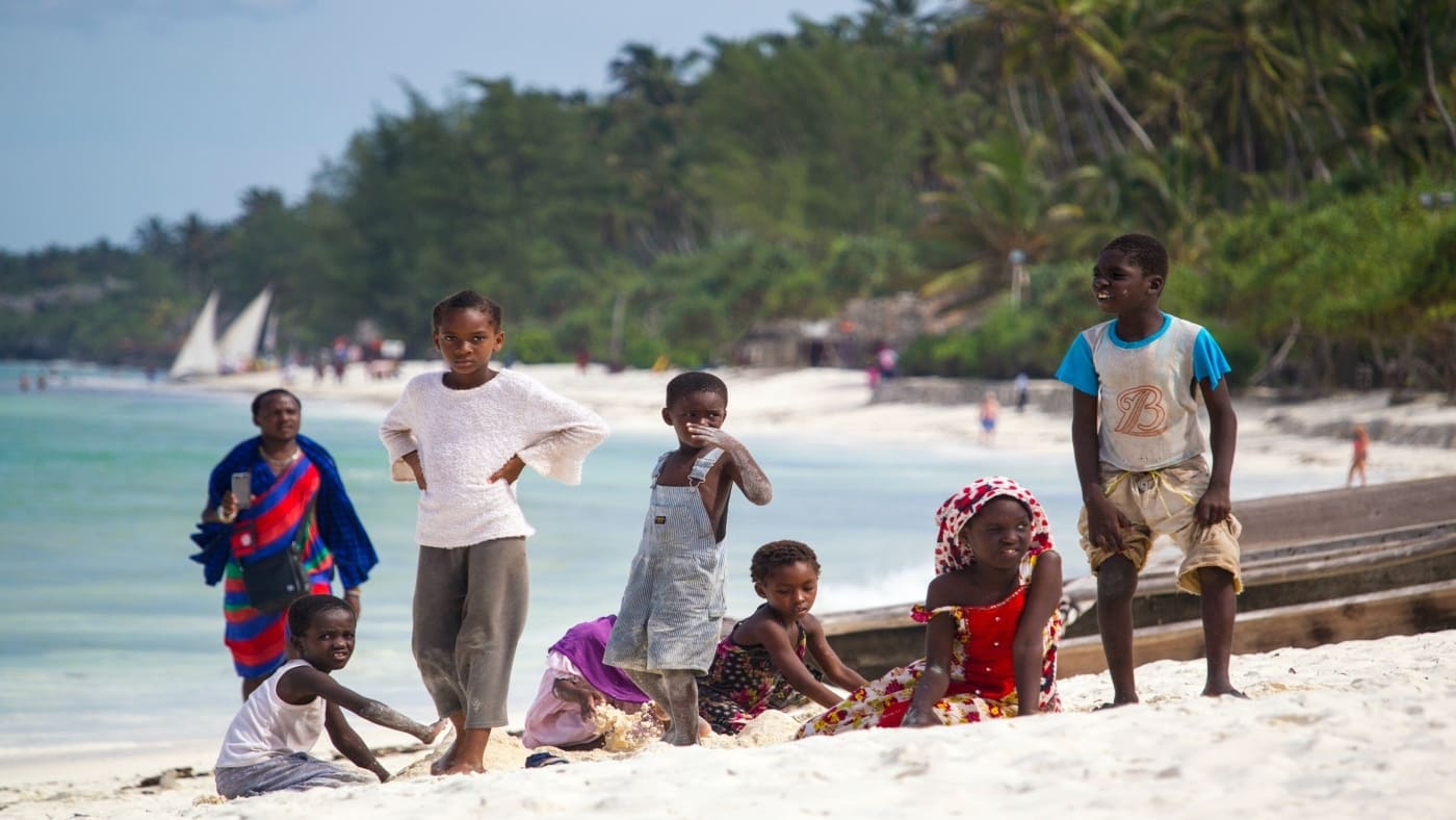 Children playing on a Zanzibar beach, reflecting local culture with B4Experience