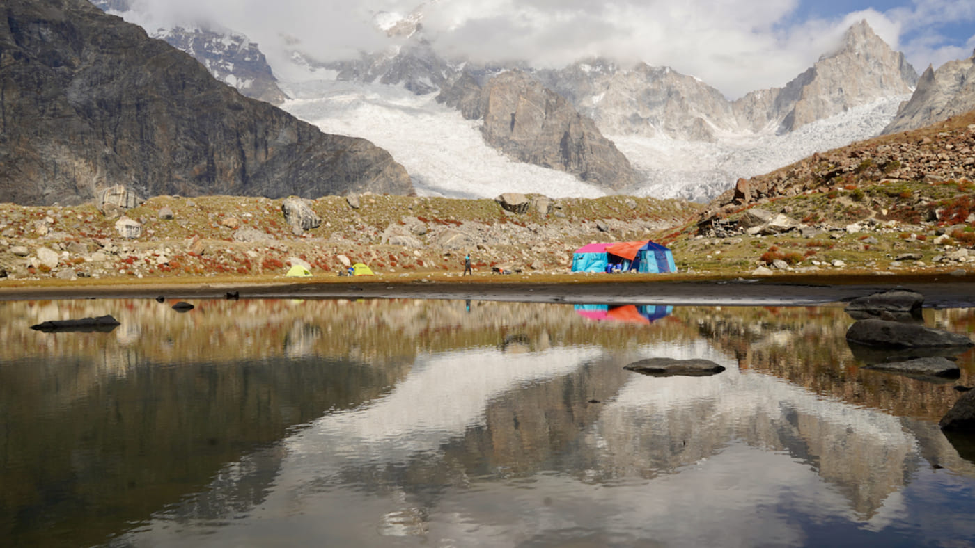 Laila Peak reflected in an alpine lake at basecamp -B4Experience