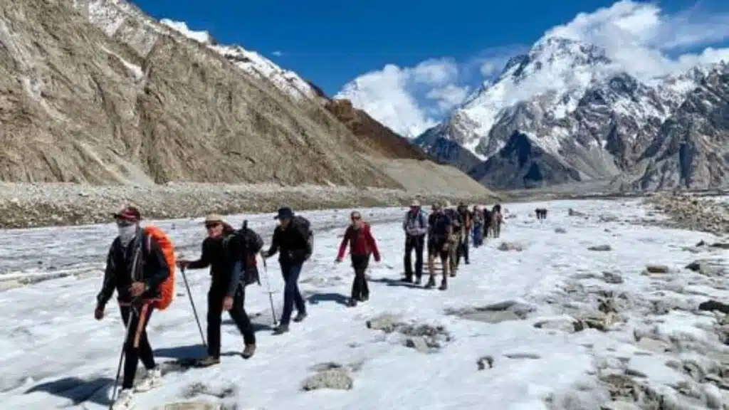 Trekkers cross a frozen landscape in Trekking Baltoro K2 - B4Experience
