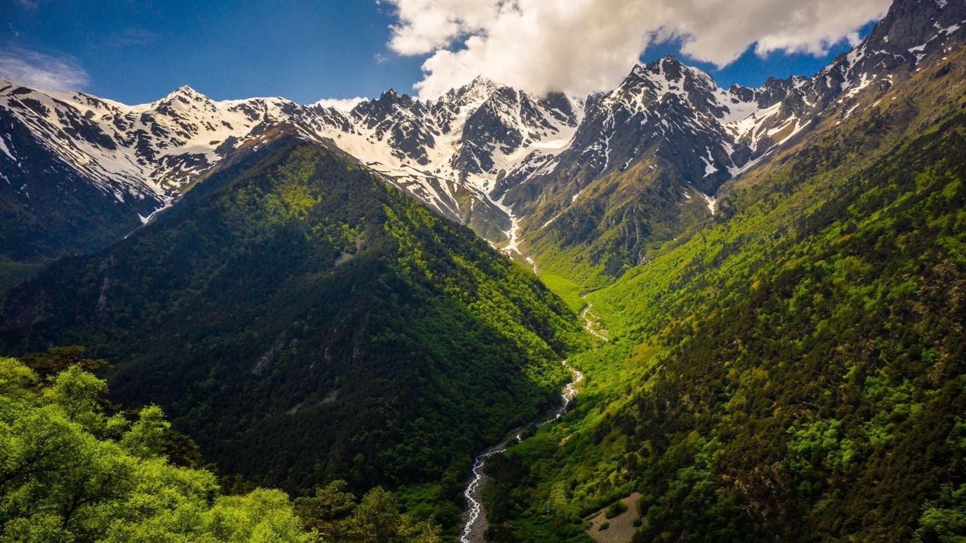 Stunning view of the Caucasus Mountains with lush green valleys - B4Experience